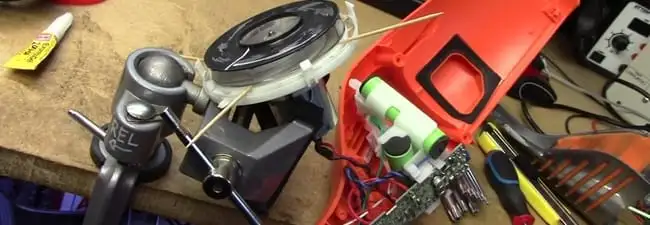 Vacuum cleaner repair parts and tools on a workbench in Ann Arbor, MI